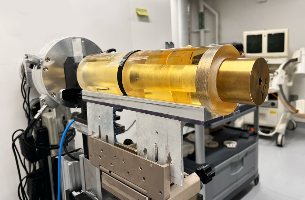 A conical gold-colored device in a proton research room designed to make a proton beam conformal